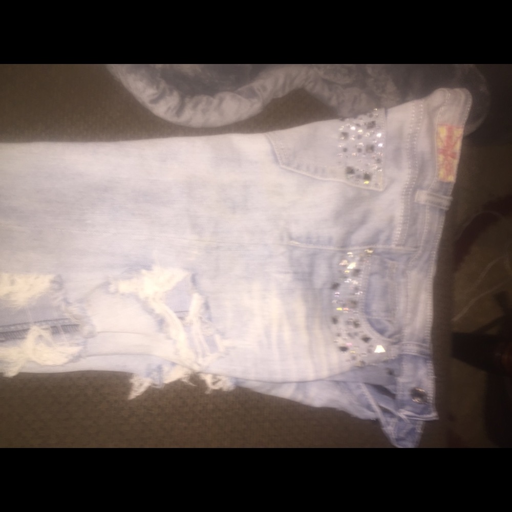 Distressed machine jeans